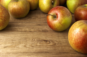 red apples on wooden table