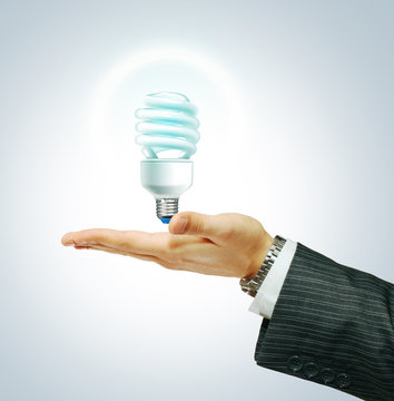 Saver Lightbulb on businessman hend