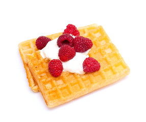 waffles with whipped cream and raspberrries