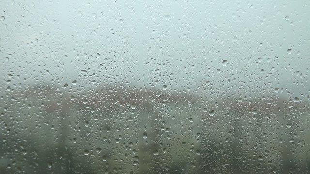 Rain drops running  window pane