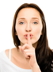 Naklejka premium Woman with finger on lips closeup isolated on white background