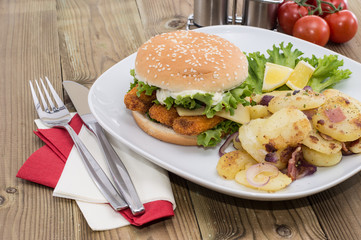 Fish Burger with fried Potatoes