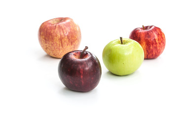Fototapeta na wymiar four colour apples on white