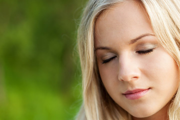 Beautiful girl relaxing near river