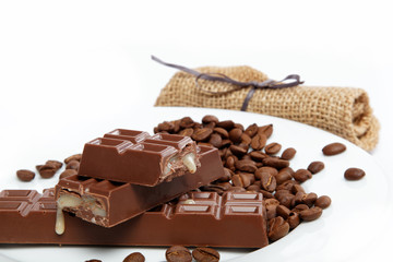 Chocolate and coffee beans on sacking.