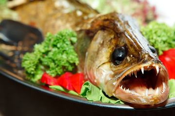 fried fish with fresh herbs