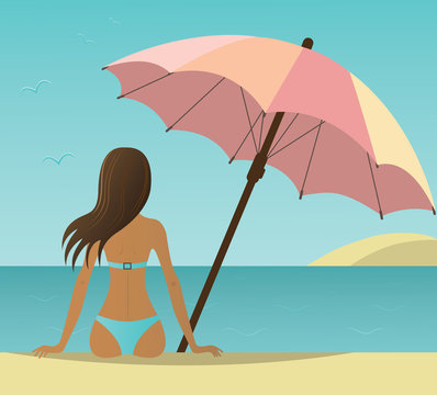 Woman on the beach under umbrella.