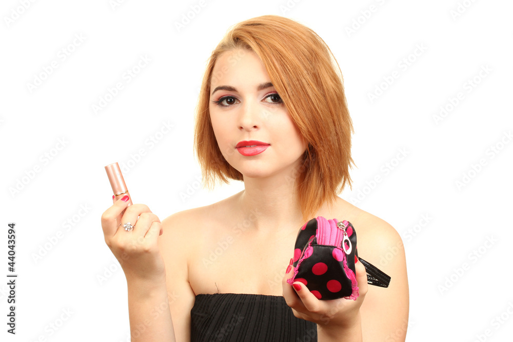 Wall mural Beautiful young woman with lipstick and cosmetics bag