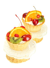 sweet cakes with fruits isolated on white