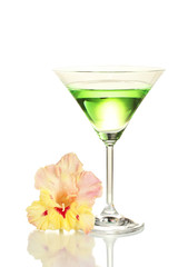 glass with cocktail and gladiolus bud isolated on white