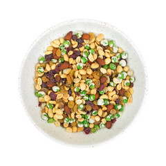 Nuts with dried fruit and wasabi peas in bowl