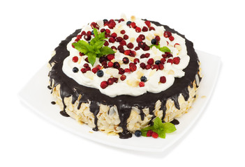 Chocolate cake with chocolate icing, whipped cream, wild strawbe