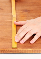 measuring wooden board close-up