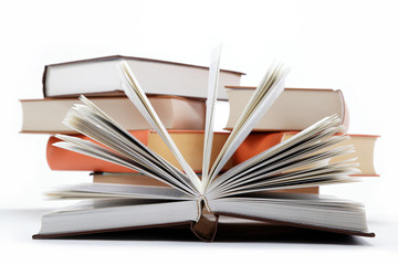 A stack of books on a white background.
