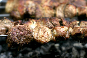 Insanely delicious kebab prepares on the fire outdoors
