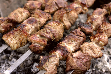 Insanely delicious kebab prepares on the fire outdoors