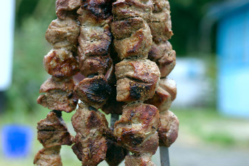 Insanely delicious kebab prepares on the fire outdoors