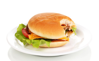 Bitten cheeseburger on plate isolated on white