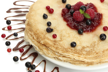 Delicious pancakes with berries and jam