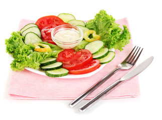 Chopped vegetables and sauce on plate isolated on white