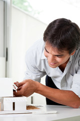 Architect Building a House Model