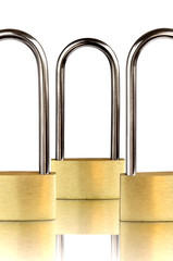 Three padlocks with shackle