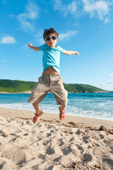Fototapeta na wymiar young boy jump in the sea