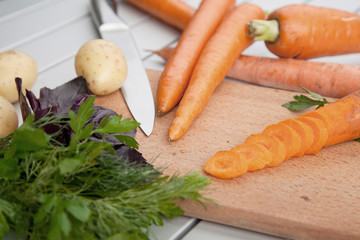 Fresh carrots on a cutting board.
