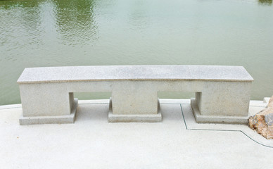 concrete bench  beside the pond