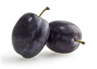 Two plums isolated on white background with clipping path