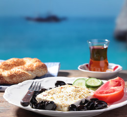 Turkish breakfast against a beach