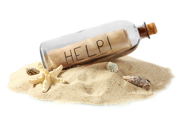 Glass bottle with note inside on sand isolated on white