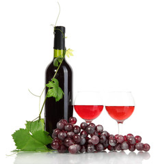 bottle, glasses of wine and ripe grapes isolated on white