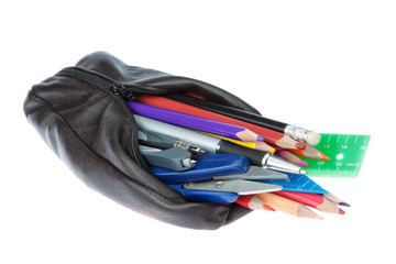 Pencil case with school supplies on a white background.