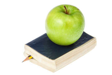 The book and an apple. On a white background.