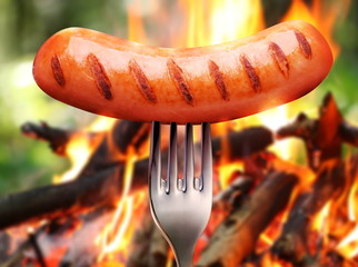 Sausage on a fork.