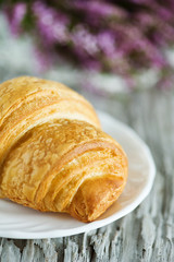 Croissant on the white plate