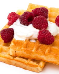 waffles with whipped cream and raspberrries