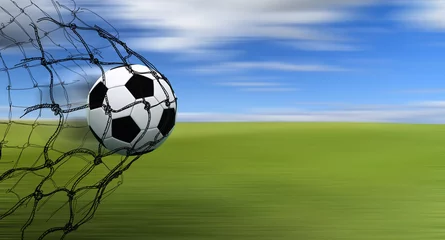 Deurstickers Voetbal soccer ball in a net