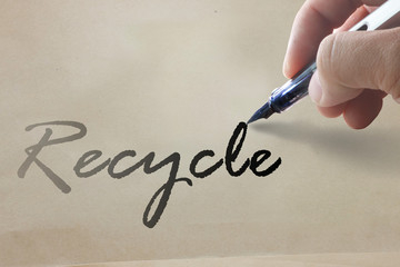 hand write recycle word on recycle paper