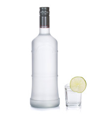 bottle of vodka with lime isolated on white
