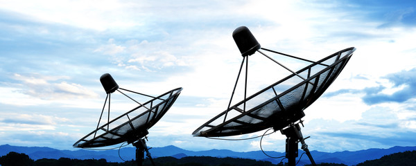 satellite dish antennas under blue sky