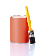 Can of paint with paintbrush isolated on white close-up