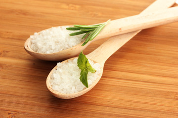 salt in spoons with fresh  rosemary and basil