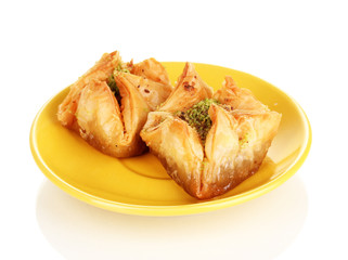 Sweet baklava on plate isolated on white
