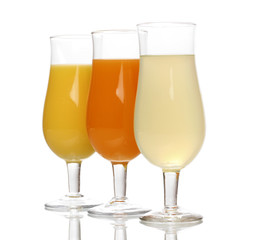Tropical juices in glasses isolated on white