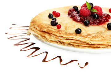Delicious pancakes with berries and jam