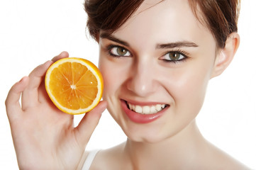 happy young woman with orange isolated on white background