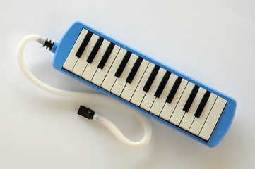 Blue Pianica with mouthpiece © Arena Photo UK