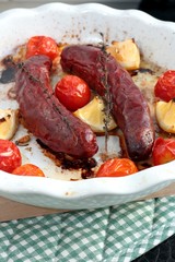 Sausages with cherry tomatoes, lemon and thyme